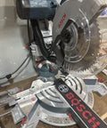 Custom 3D Printed Dust Collection Attachment for 12 Inch Glide Miter Saw GCM12SD installed, showing black adapter and hose hookup.