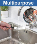 Two-piece stainless steel spatula set with black handles for kitchen use, shown in a sink.
