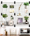 Gridwall display using 24 Piece Black Metal Gridwall Mount Brackets With Screws for organized home or office workspace