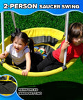Two kids enjoying the 2-person saucer swing on the backyard metal swing set with 5 foot wave slide two swings two person glider.