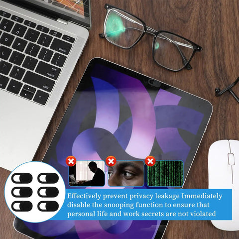 50 Pack Ultra Slim Webcam Covers Universal Laptop Phone Tablet Camera Slider Blocker on a desk with glasses and mouse.