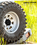 Spare Tire Bolt Retainer Clamp for Vehicle Wheels on a rugged tire mounted on a vehicle, showcasing an easy install design.