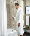 Bathroom scene with Genta LX Chrome Modern 18-Inch Single Kitchen or Bathroom Towel Bar with sleek mirror-like finish