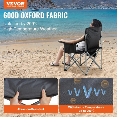 Person relaxing in Oversized Camping Folding Chair With Quad Lumbar Back Support, Padded Comfort, on beach next to cooler bag