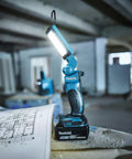 18V LXT Cordless 12 LED Flashlight with Foldable Head and 360-Degree Swivel Hook shown on worksite