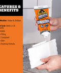 Heavy Duty Construction Adhesive White Glue 7 Ounce Squeeze Tube Tough As Nails For Indoor And Outdoor Projects Waterproof Gap Filling Quick Grip In About 30 Seconds Paintable being applied from a tube.