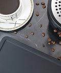 Ultra Thick Espresso Tamping Mat For Large 5x12 Inch Coffee Bar Station Silicone Tamper Pad with coffee cup and beans on countertop