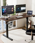 55 Inch By 24 Inches Electric Standing Desk, Height Adjustable Sit Stand Home Office Table With Smooth Motor Touch Controls, Ergonomic Walnut Finish For Better Posture And Comfortable Working in modern workspace with dual monitors.