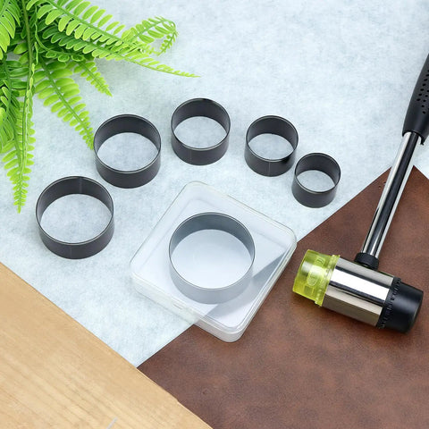 31 Piece Leather Circle Cutter Tool Set with various cutting dies and mallet, ideal for precision round holes in DIY crafts.