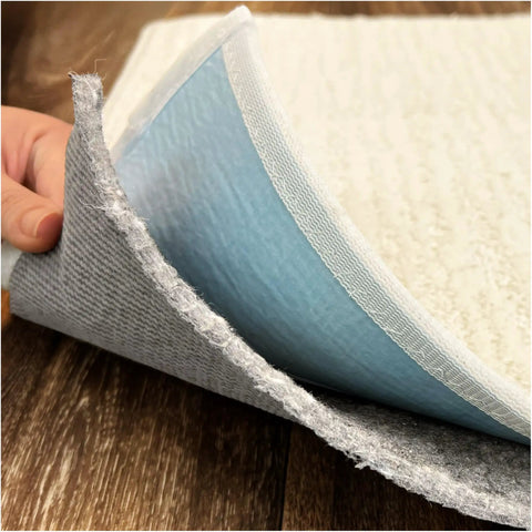 Close-up of Non Slip Rug Pad Runner Two Point Five By Nine Feet Thick Quarter Inch Felt And Rubber Duo Lock Grip being lifted