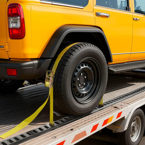 Yellow vehicle secured with ratchet strap from Six 5 Foot E Track Rails Kit With Ratchet Straps O Ring Anchors Tie Offs D Ring End Caps And 1500 lb Gear Securement For Vans Trailers Garages And Motorcycles.