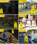Image showing Four Pack 24 Inch Slow Down Kids At Play Sign Reflective Double Sided Street Safety Signs With Portable Handles For Neighborhoods Yards Schools And Parks Yellow in various locations like park, school, road.