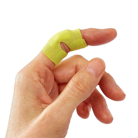 Close-up of yellow fabric strip from Extreme Hold Antibacterial Bandages For Fingers And Knuckles on thumb, flexible design