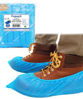 Person wearing waterproof disposable shoe and boot covers XL set over brown boots, with package showing 100 pack and 50 pairs label.