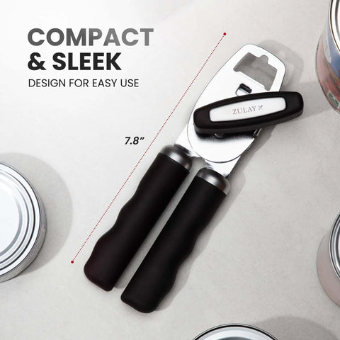 Comfy Manual Can Opener With Bottle Opener, Rust Proof Stainless Steel, Turn Knob, Soft Grip Handles, black kitchen tool on table