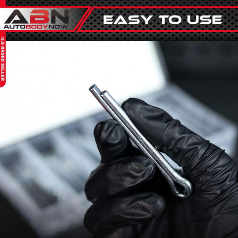 Close-up of a hand holding a steel cotter pin from the Large Cotter Pin Key 144 Pc Assortment Set 1 Eighth By 2 In To 1 Quarter By 3 In Steel