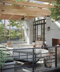 Outdoor patio with Grandbury Collection 1-Light Clear Glass Farmhouse Outdoor Wall Lantern in Textured Black, coastal vibe.
