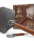 Viking Style Pizza Peel With Cutter Rocker, Heavy Duty Metal Paddle 14x12 Inches, foldable wood handle, nonstick spatula in front of box.