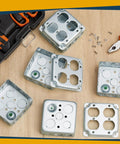 Four Pack 4 By 4 Inch Electrical Junction Boxes With Covers, Metal Outlet Box Set, 21 Cu In Capacity Receptacle Exposed Work, 1-1/2 Inch Deep, Double Duplex Configuration For DIY Reno Projects displayed on a wooden surface with tools.
