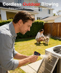 Man using F3 Electric Air Duster Three Gear Power, 150000 RPM High Speed Blower for cleaning outdoor unit grill.