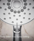 Close-up of Forté Four-Function Handshower With Nonpositive Shutoff spray settings dial, polished chrome finish.