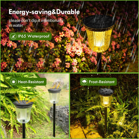 Solar Pathway Lights 4 Pack Outdoor IP65 Waterproof Garden Lights in rain, surrounded by plants, showcasing durability and lighting modes.