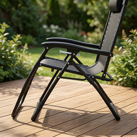 Side view of folding recliner chair with black metal frame on wooden deck, showing durable construction for wobble-free performance.