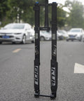 Beefed-Up Downhill Mountain Bike Front Fork With Air Suspension, Thru-Axle Boost 110x15, shown on open road