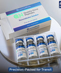Front view of QuantaNova Reconstitution Solution 4-pack: four sterile glass vials, 10 mL each, blue caps.