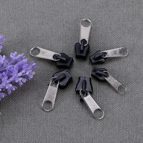 Universal Zipper Repair Kit 6Pcs Black Instant Fix Replacement Zipper Slider Teeth Pulls on gray fabric background