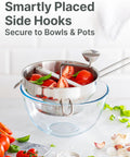 4 Disc Stainless Steel Food Mill With Ergonomic Hand Crank shown over a bowl with tomatoes for tomato sauce canning and puree.