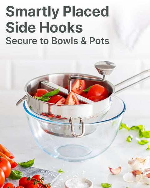 4 Disc Stainless Steel Food Mill With Ergonomic Hand Crank shown over a bowl with tomatoes for tomato sauce canning and puree.