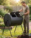 Man using Dual Chamber Compost Bin Tumbler For Outdoors 37.5 Gallon All Season Garden Kitchen Yard System in a garden