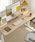 Fezibo 48 By 24 Electric Standing Desk With Double Drawers Maple Finish, ergonomic design with a computer setup.