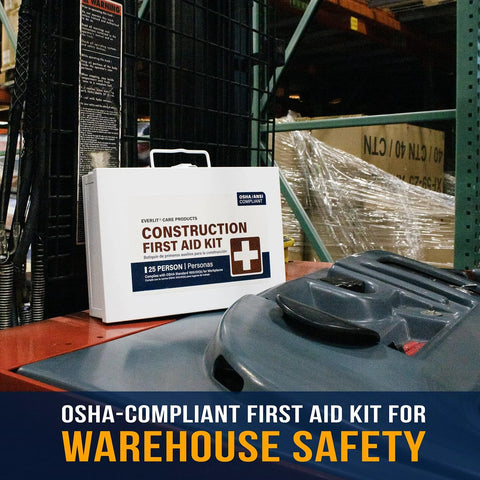 Front view of white construction first aid kit box with handle, OSHA compliant, on warehouse shelf.