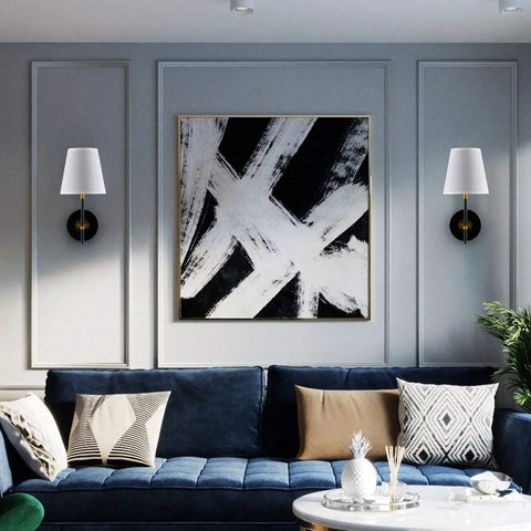 1 Light Wall Sconce With Plug In Cord And White Fabric Shade In Matte Black Finish on living room wall above sofa