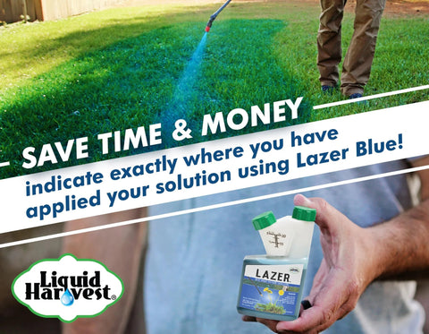Liquid Harvest Lazer Blue spray pattern indicator bottle, 8 oz, front view held over green lawn.