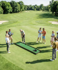 Group of people using Automatic Golf Putting Machine for Indoor and Outdoor Practice on course, ball return system in action