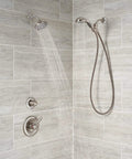 Three-Function Shower Diverter Trim Kit In Stainless Finish installed in a tiled shower with dual shower heads