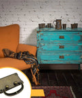 Retro Rectangle Pull Handles With Screws For Furniture Cabinet showing bronze handle on a teal dresser with brick wall backdrop.