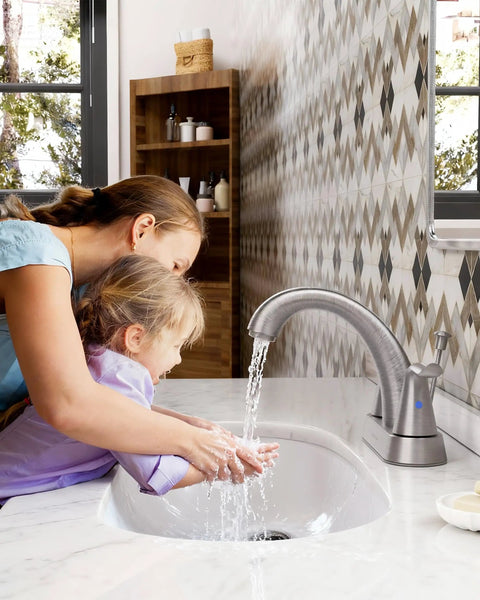 Woman helping child wash hands under 2 Handle 4 Inch Centerset Bathroom Sink Faucet With Lift Rod Drain Stopper Lead Free Brushed Nickel