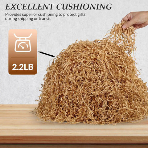 Hand holding 2.2 Lb Brown Crinkle Shredded Paper For Gift Baskets And Gift Boxes, Go-To Basket Filler And Gift Box Stuffing