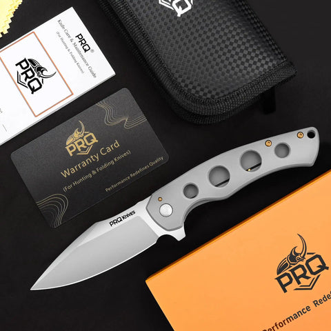 Nomad EDC Folding Pocket Knife with 3.54 Inch 14C28N Steel Blade, satin finish, and handle, shown with warranty card and pouch.