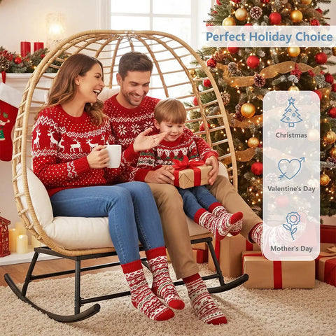 Family enjoying Double Wicker Egg Chair Rocker For Indoor Or Outdoor Patio Cozy Two Person Lounge Chair With Thick Cushions 680 Lbs Capacity Hand Woven PE Rattan Beige during holidays.