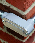 ProConnex Rigid Type LB Half Inch Conduit Body 02 55641LB Conduit Fitting installed on brick wall, aluminum die-cast
