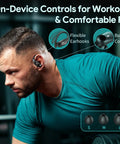 Man wearing noise cancelling wireless buds with 80 hours of playtime and power display case for sports and gym workouts.