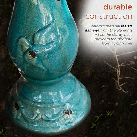 Close-up of 25 inch tall outdoor ceramic antique pedestal birdbath with turquoise finish showing bird figurines and sturdy base.