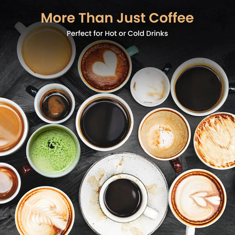 Assorted coffee cups with various designs and latte art on a dark surface.