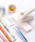 Killer Precision Donut Punch For Washi Tape And Paper Crafting Tool For Ring Binder Hole Repair and Planner Sticker Making with washi tapes and tweezers.
