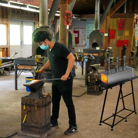 Blacksmith using a Portable Propane Forge With Triple Burners And One Side Door For Blacksmithing And Knife Making Pro Grade 2600F.